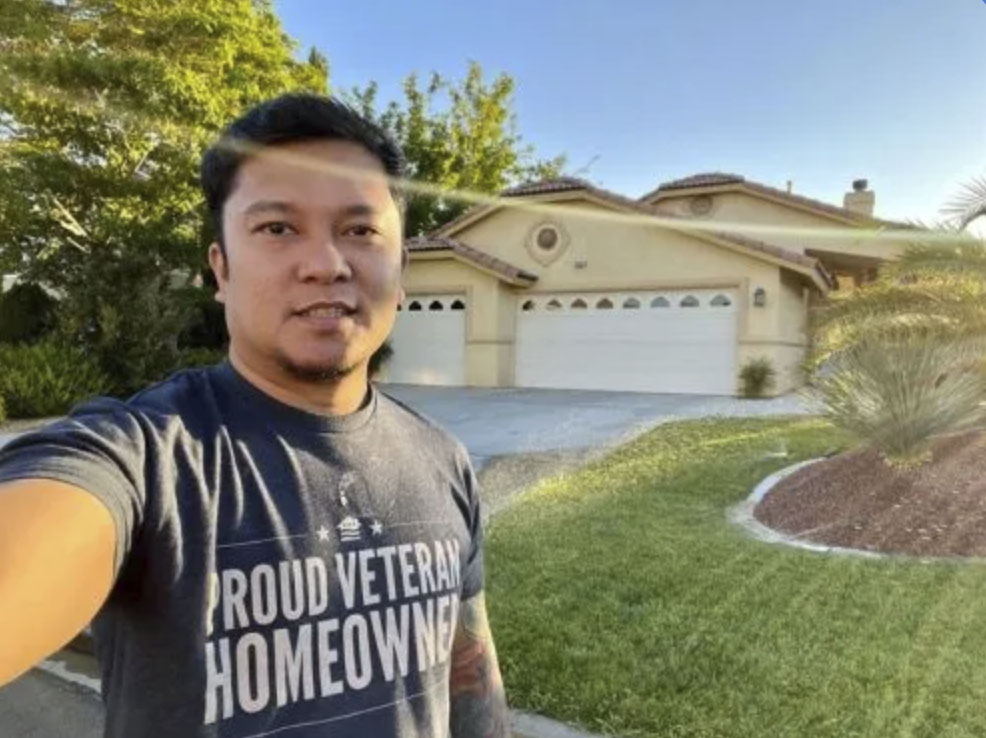 picture of Dan J. in front of a house