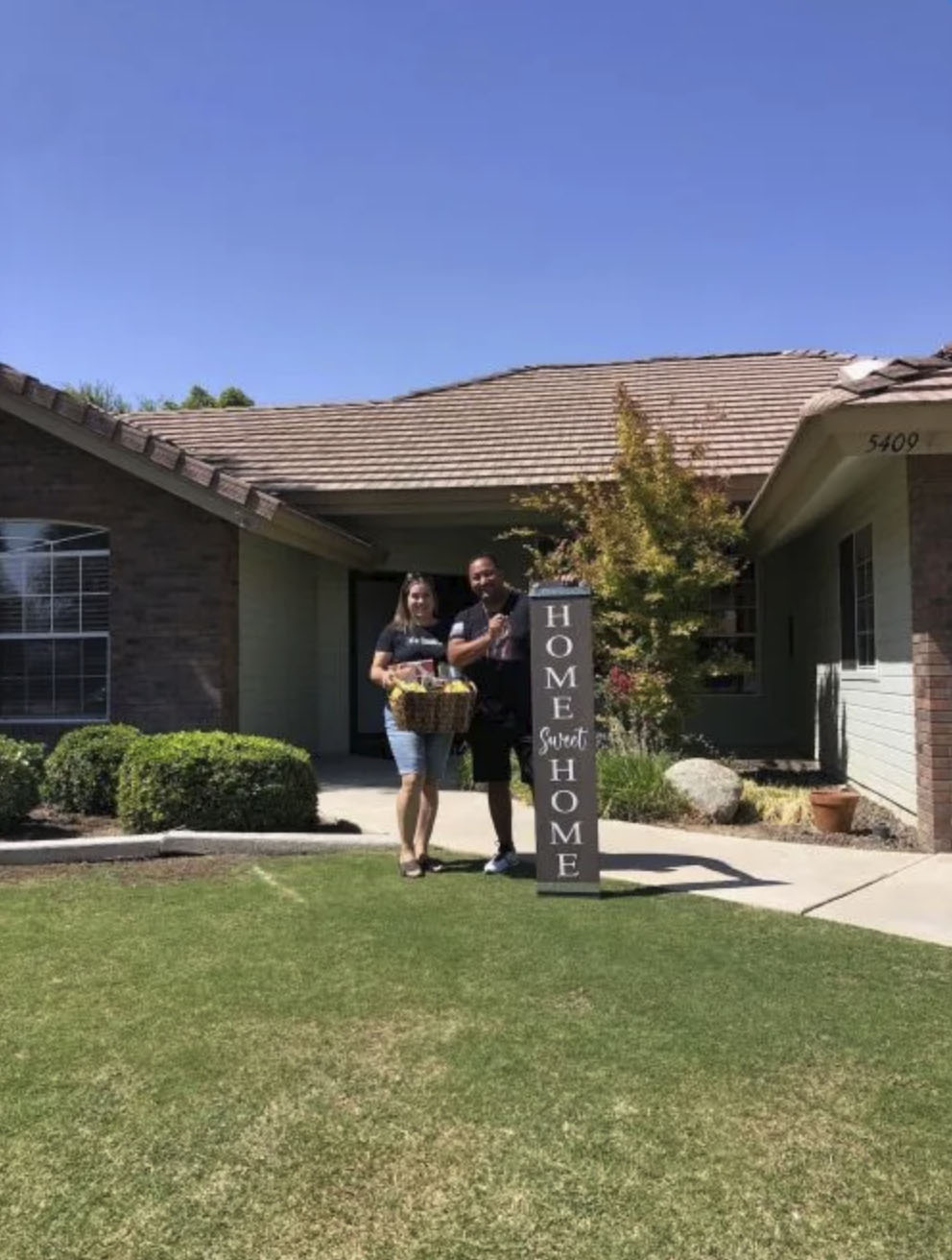 picture of Javier A. in front of a house