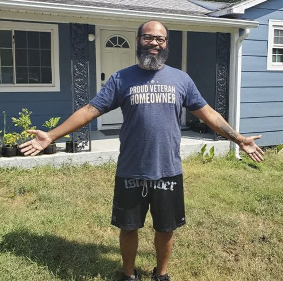 picture of Jacob P. in front of a house